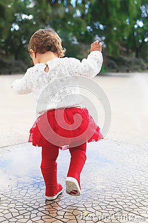 Running trought puddles Stock Photo