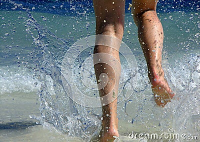 Running through waves Stock Photo