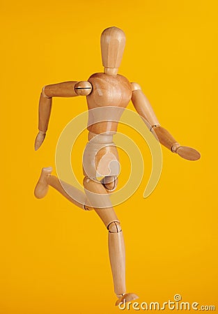 Running wooden doll Stock Photo