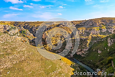 Rupestrian stones, historic building. La Gravina di Matera. Basilicata under blue sky Stock Photo