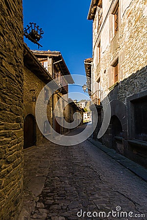 RUPIT, CATALONIA, SPAIN April 2016: Street with brutal rustic medieval houses Editorial Stock Photo