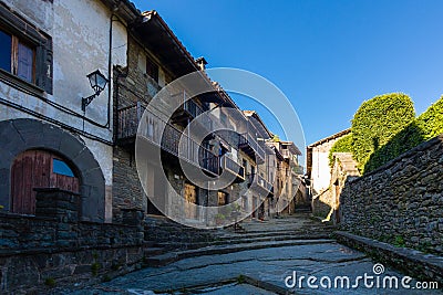 RUPIT, CATALONIA, SPAIN April 2016: A view of the medieval street on volcanic rock Editorial Stock Photo