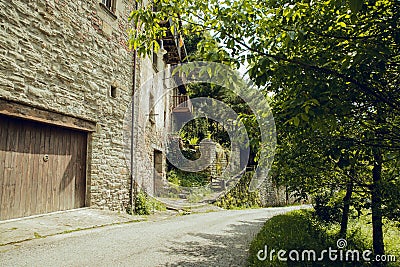 RUPIT and PRUIT, SPAIN - JULY, 2020: Medieval village of Rupit, stone houses with roofs. Interior of the town Editorial Stock Photo