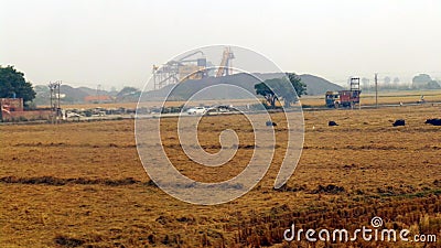 Rural Area having stone crusher working in background Stock Photo