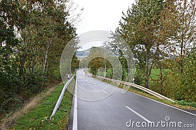 rather staight rural avenue with construction works Stock Photo