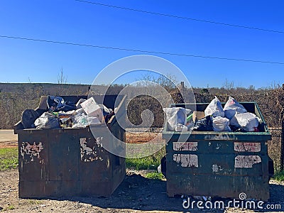 A rural county public waste trash dump for local residents over flowing dumpsters Editorial Stock Photo