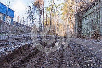 Rural dirty damaged road with mud Stock Photo