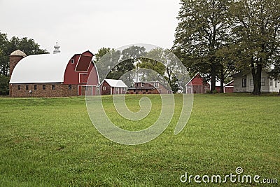 Rural farm house barn green grass Stock Photo