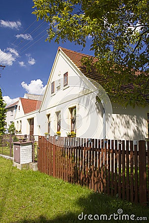 Rural houses and large barns in the fields Stock Photo