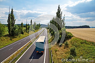 The rural landscape with a highway leading poplar alley Stock Photo