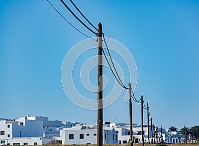 Rural power line in southern village Stock Photo