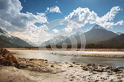 Rural river water at alpine mountains Stock Photo