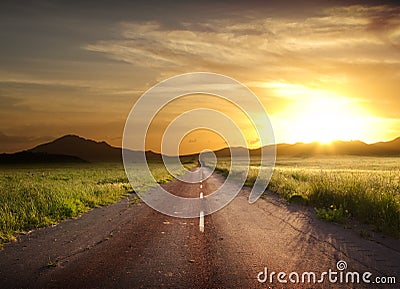 Rural Road Fiery Sunset Stock Photo