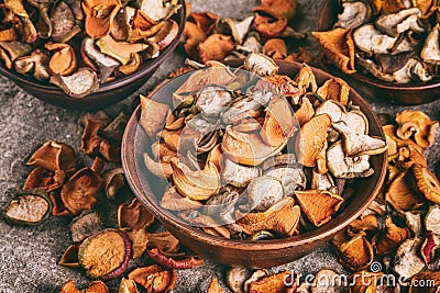 Rural still-life, background - dried fruits from apples and pears in clay bowl Stock Photo