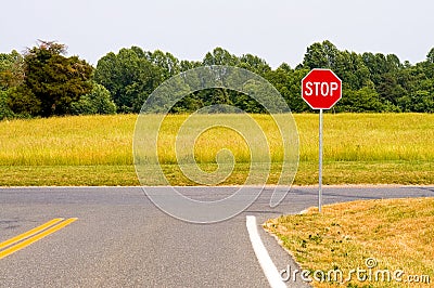 Rural stop sign intersection Stock Photo