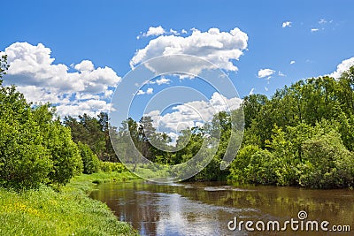 Rural summer landscape with forest, river, blue sky and white cl Stock Photo