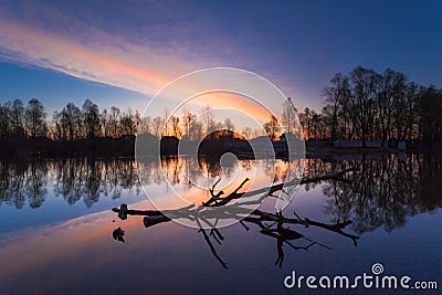 Rural summer sunrise landscape with river and dramatic colorful sky Stock Photo