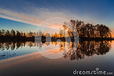 Rural summer sunrise landscape with river and dramatic colorful sky Stock Photo