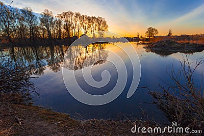 Rural summer sunrise landscape with river and dramatic colorful sky Stock Photo