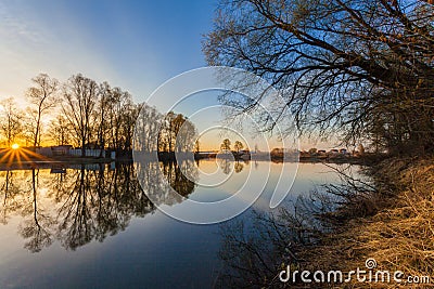 Rural summer sunrise landscape with river and dramatic colorful sky Stock Photo