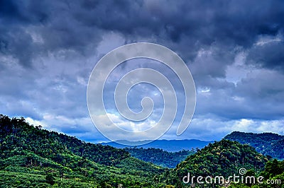 Rural view of mountain with raincloud Stock Photo