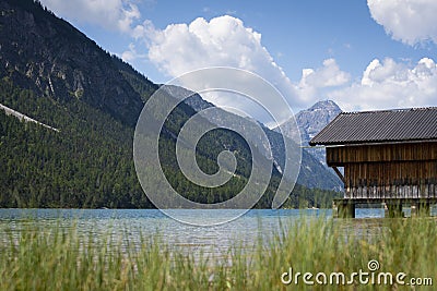 Rural wooden boat house at wonderful mountain lake plansee Stock Photo