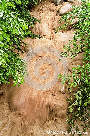Rushing Muddy Floodwaters Stock Photo