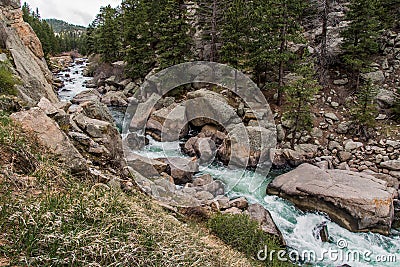 Rushing stream river water through Eleven Mile Canyon Colorado Stock Photo