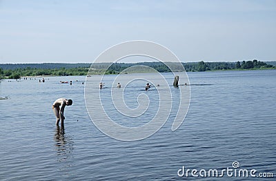 Russia - Berezniki July 18 : young people jump into the river at sunset Editorial Stock Photo
