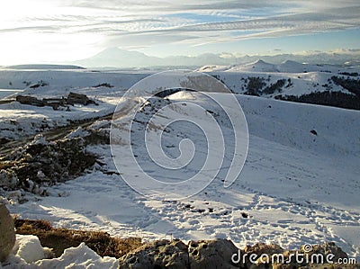 Russia, Caucasia. Road and snow on mountain and blue sky background, horizontal view. Stock Photo