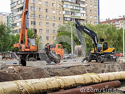 Russia, Chelyabinsk 08/02/2020 Laying and replacement of water supply pipes, construction equipment for the repair of communicatio Editorial Stock Photo