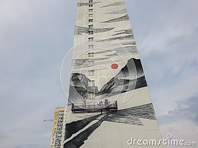 Russia, Chelyabinsk 08/03/2020 Redecoration of a high-rise building, artists ennoble the end of the building, applying modern pain Editorial Stock Photo
