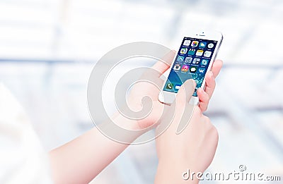 Russia, Chelyabinsk, September 8, 2014. Person holding a new white Apple iPhone 5S, smartphone in part of the iPhone line. Develo Editorial Stock Photo