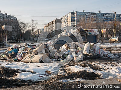 Russia, Chelyabinsk, 10.03.2020. Trash can overflowed over the edges. Editorial Stock Photo