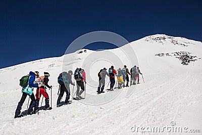 Russia, Elbrus - JULY 29, 2018: a Group of climbers lined up one after another go to the top of the mountain.every year thousands Editorial Stock Photo