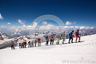 Russia, Elbrus - JULY 29, 2018: a Group of climbers lined up one after another go to the top of the mountain.every year thousands Editorial Stock Photo