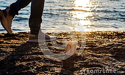 Russia, Gelendzhik - May 4, 2021: white glass of juice from McDonald's. McCafe paper glass drink. Editorial Stock Photo