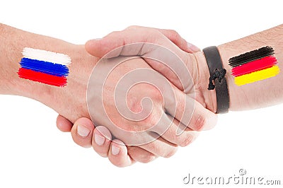 Russia and Germany hands shaking with flags Stock Photo