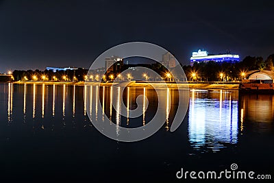 Russia, Irkutsk - July 19, 2019: Colorfull reflection in Angara river of night photo near embankment, Irkutsk Editorial Stock Photo