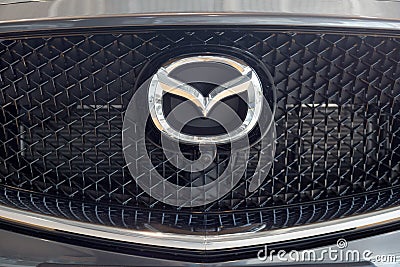 Russia, Izhevsk - August 06, 2020: Logo of Mazda car on display in the dealer showroom Editorial Stock Photo