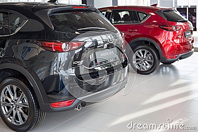 Russia, Izhevsk - August 06, 2020: Mazda showroom. New modern cars in the dealer showroom. Famous world brand Editorial Stock Photo