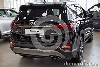 Russia, Izhevsk - January 23, 2020: New modern crossover Santa Fe in the Hyundai showroom. Back view. World brand Editorial Stock Photo