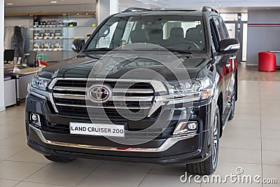 Russia, Izhevsk - July 21, 2019: New cars in the Toyota showroom. Modern Land Cruiser 200. Famous world brand Editorial Stock Photo