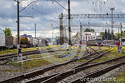 Russia, Kaluga - OCTOBER 27, 2020: Railroad tracks with passenger electric train and freight trains Editorial Stock Photo