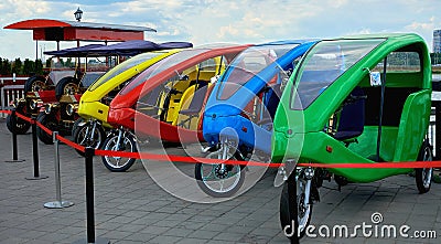 Russia, Kazan June 2019. Three-wheeled vehicles and antique cars for sightseeing tours Editorial Stock Photo