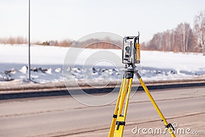 Russia Kemerovo 2019-03-15. Land surveyor equipment. Robotic total station theodolite standing on tripod. Equipment used for Editorial Stock Photo