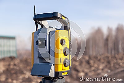 Russia Kemerovo 2019-03-15. Land surveyor equipment. Robotic total station theodolite standing on tripod. Equipment used for Editorial Stock Photo