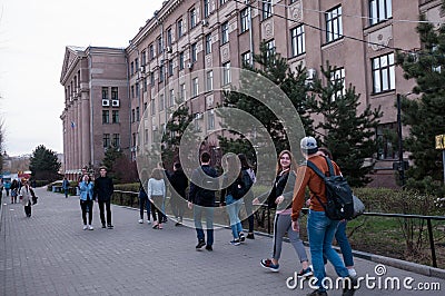 Young people walking in the city center near the medical University Editorial Stock Photo