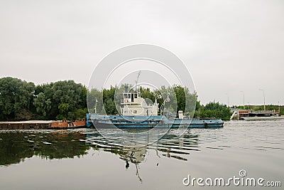 08/21/2021 Russia, Kolomna. An old rusty barge sails by on the Moscow River in summer Editorial Stock Photo