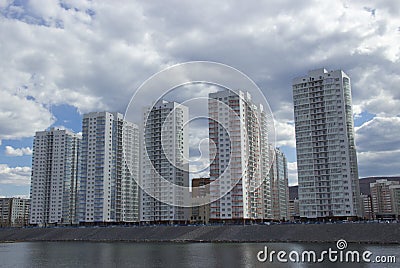 High multi-storey residential buildings on the river Bank Editorial Stock Photo